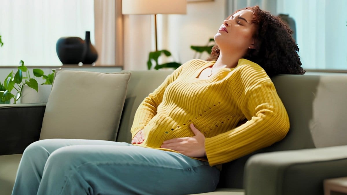 Woman with severe gas pain and stomach discomfort