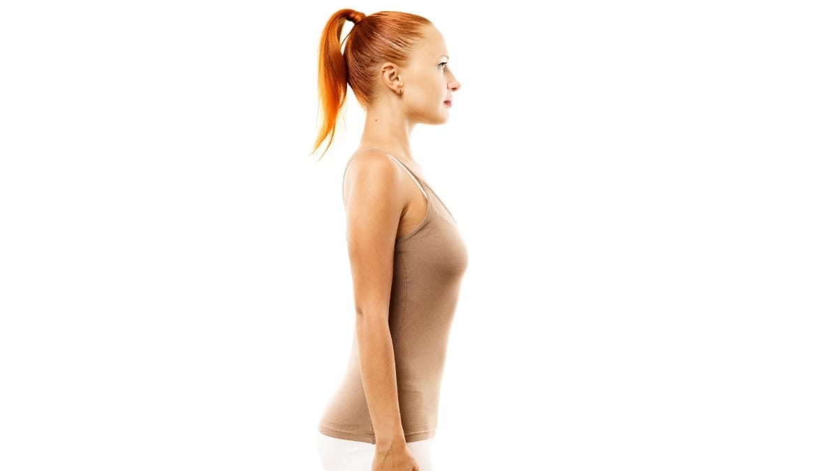 Woman is standing perfectly straight